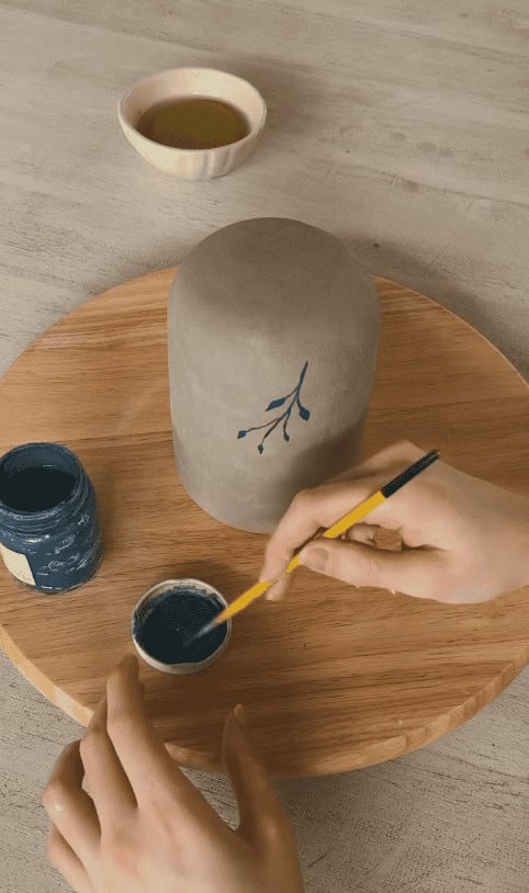 Freehand painting session. Each animal goes on in thin mineral layers — usually four passes before the colour sits right.